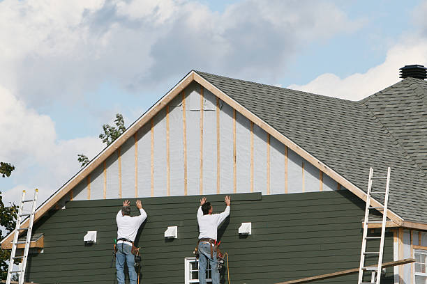 Professional Storm Damage Siding Repair technician working in Venus, TX